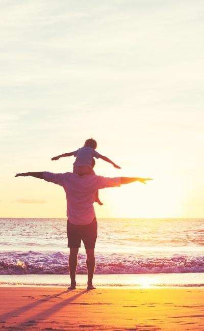 father and son on beach