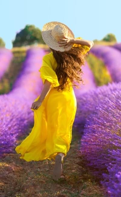 woman in field of flowers
